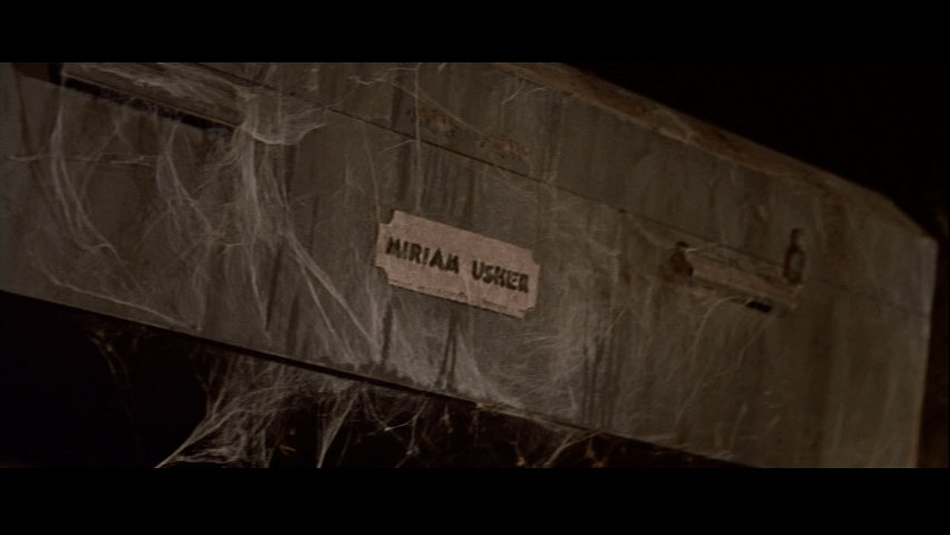 A coffin begins to fall