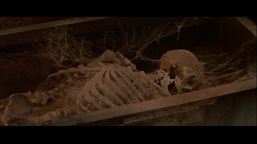 The coffin pops open, revealing a skeleton