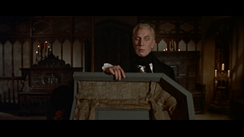 Roderick quickly closes the lid of Madeline's casket even though he knows she's alive