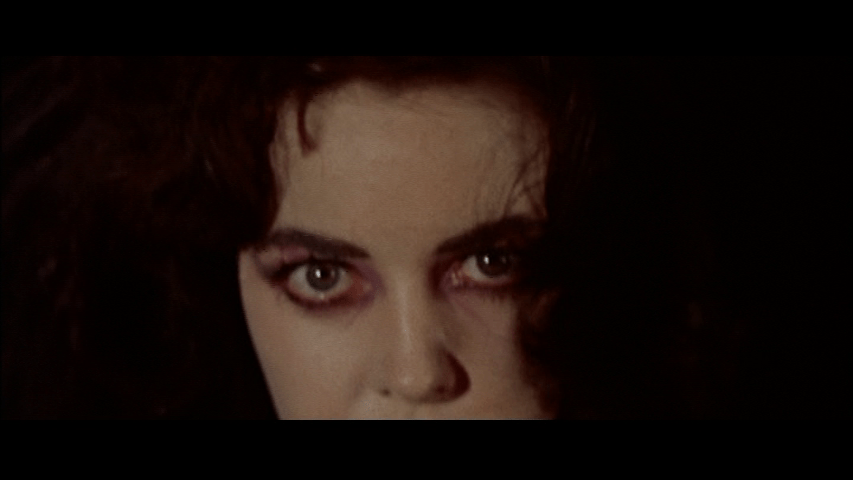 Close-up of Madeline with murder in her eyes