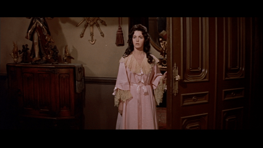 Medium shot of Madeline in a pink nightdress