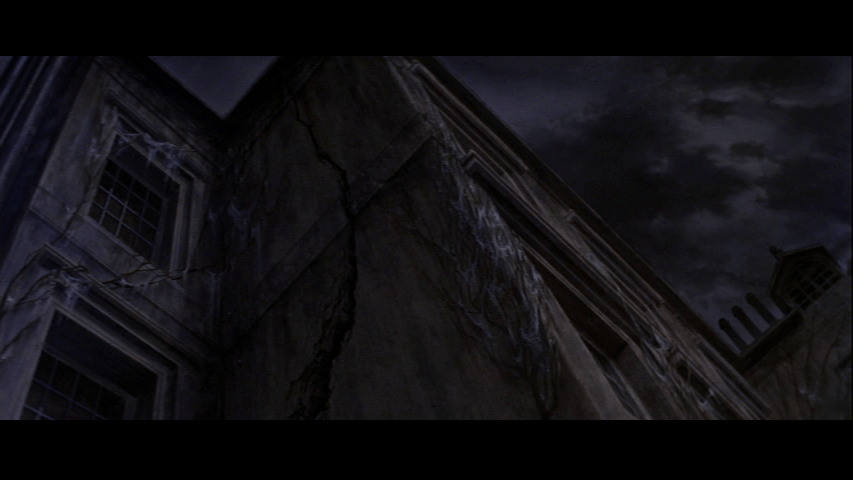 Point of view shot from Philip's perspective of a crack running the length of the house