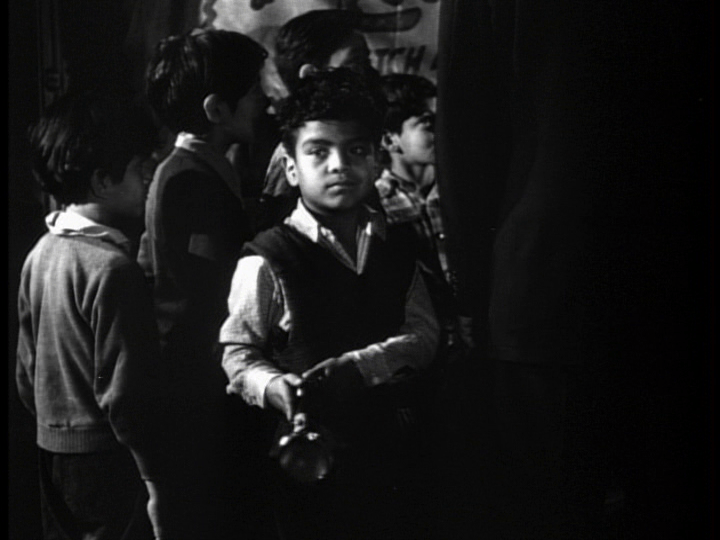 Medium shot of a boy with a flashlight