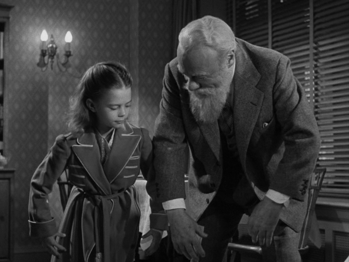 Medium shot of Kris showing Susan how to be a monkey, part one