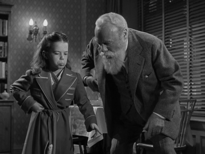 Medium shot of Kris showing Susan how to be a monkey, part three