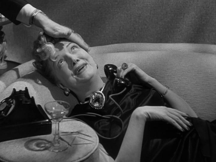 Mr. Shellhammer helps his wife, who feels wonderful, with the phone