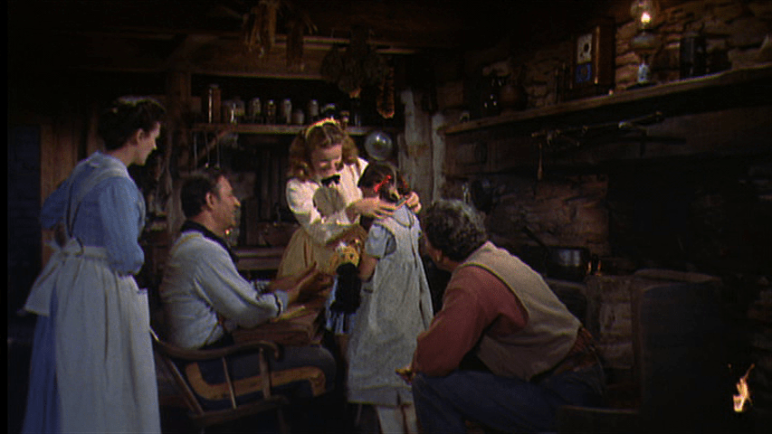 Lucy places the medal around Debbie's neck