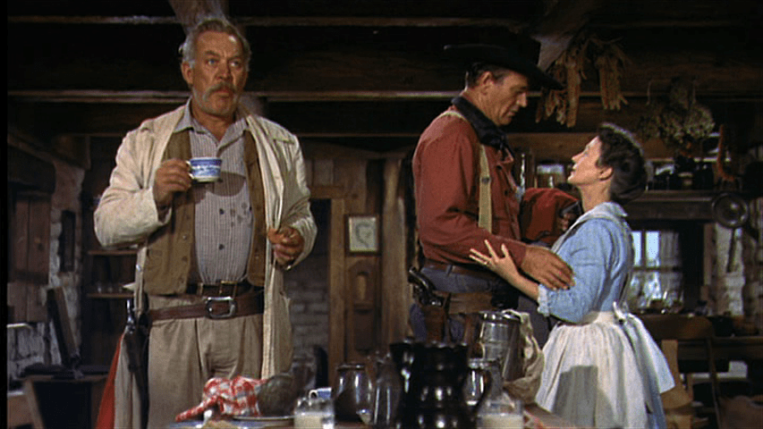 Clayton stares straight ahead while Ethan and Martha gaze tenderly at each other behind him