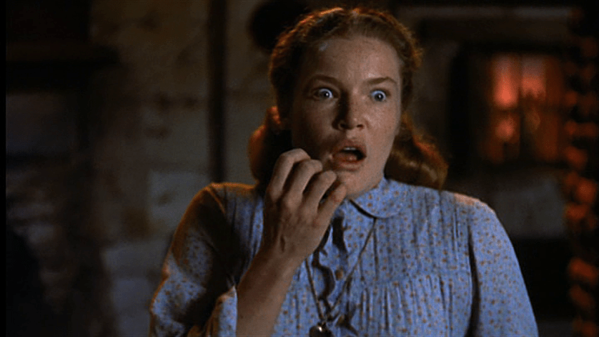 Her hand goes to her mouth