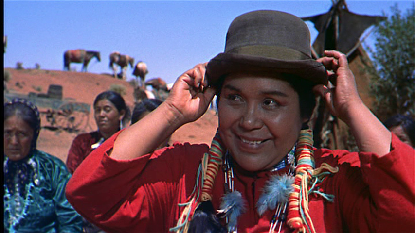 Medium shot of Wild Goose Flying in the Night Sky, who unlike many people I would *not* describe as "fat," trying on a bowler hat