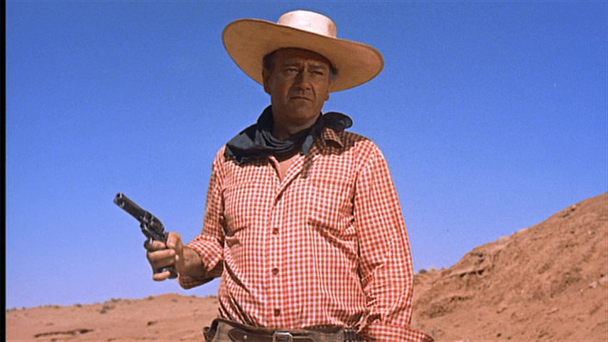 Medium shot of Ethan drawing a gun on Debbie