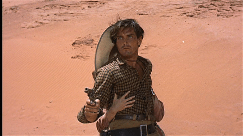 Medium shot of Marty drawing a gun on Ethan