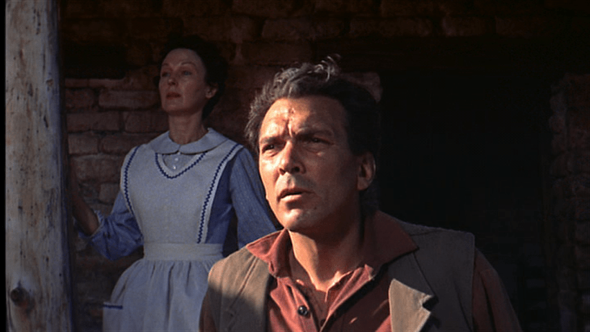 Medium shot of Aaron with Martha behind him