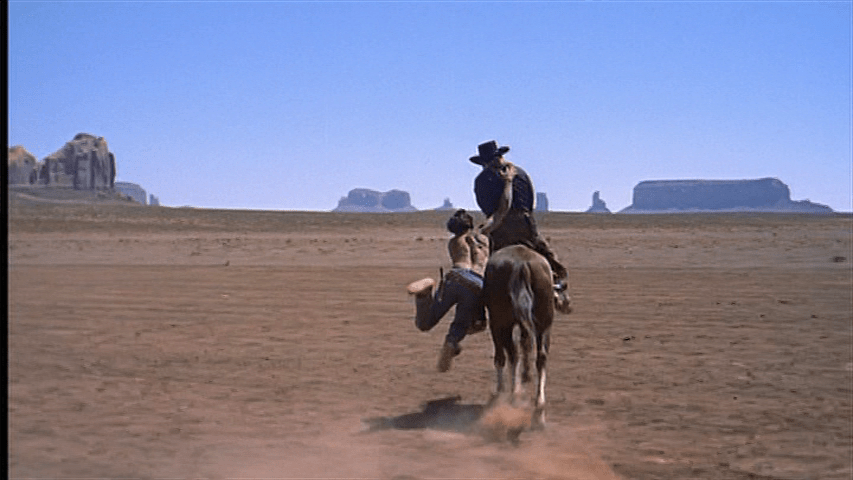 Marty attempts to drag Ethan off his horse