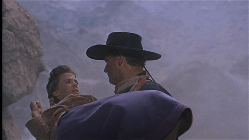 Ethan lowers Debbie and they look at each other...