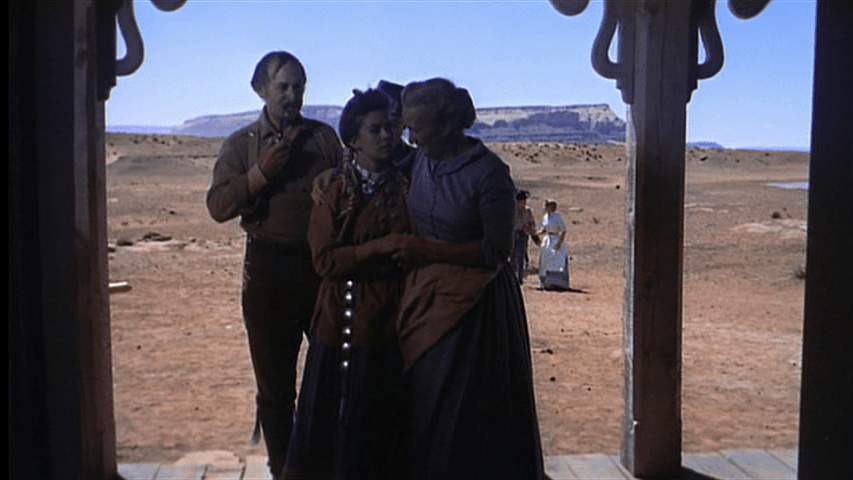 The Jorgensens take Debbie inside their home in a shot which echoes the film's first one