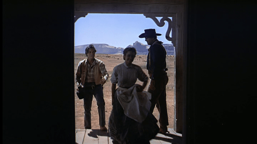 Laurie and Marty push past Ethan as he stands in the Jorgensen's doorway
