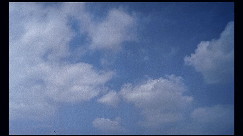 Shot of clouds which concludes Playtime's opening credits sequence