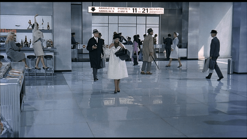 Monsieur Hulot looking as befuddled as ever in the background of a shot with nothing in particular in the foreground