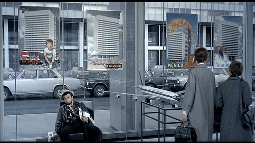 Barbara looks at three more posters for the U.S.A, Hawaii, and Mexico with the same high-rise on it