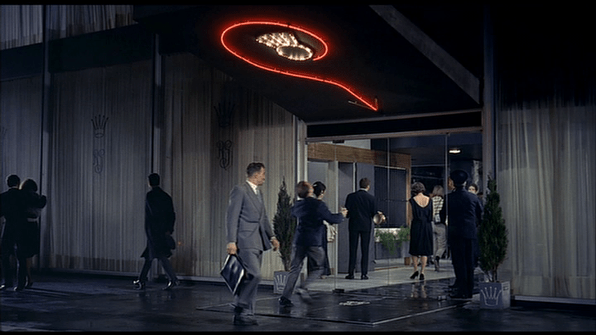 The arrow points to the door of the Royal Garden, so the drunk re-enters the nightclub