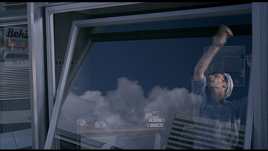 ...the bus reflected in it seems to move up and down...