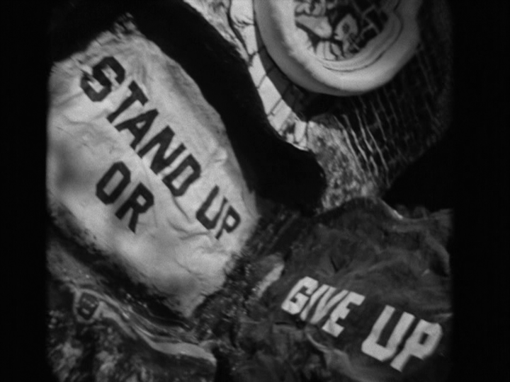 Set decorations painted with the words "Stand Up or Give Up"
