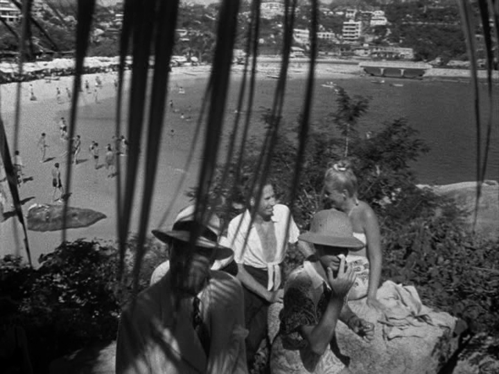 Grisby talks to Michael in a crowd of tourists, part one