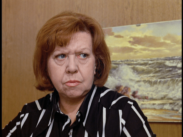 Medium shot of Emmi staring at Ali