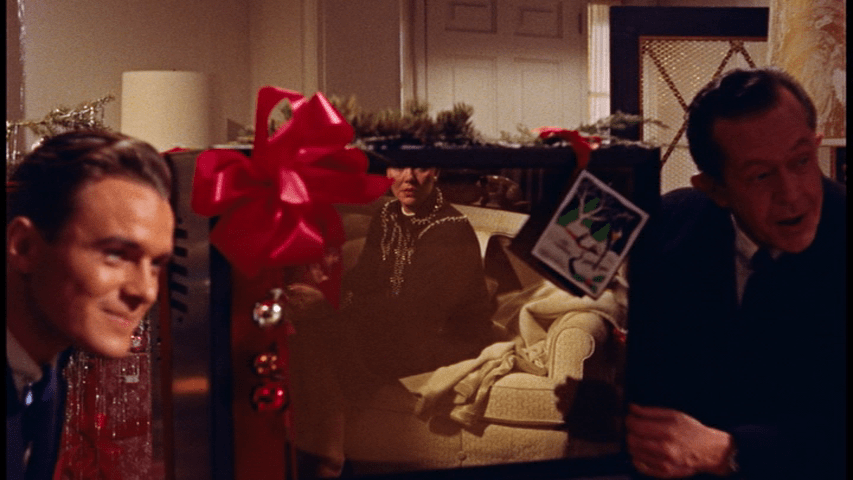 As the camera tracks in on her reflection...