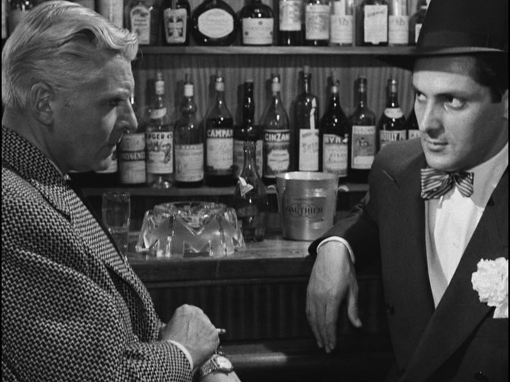 Medium shot of Bob recruiting someone to help him rob the Deauville casino