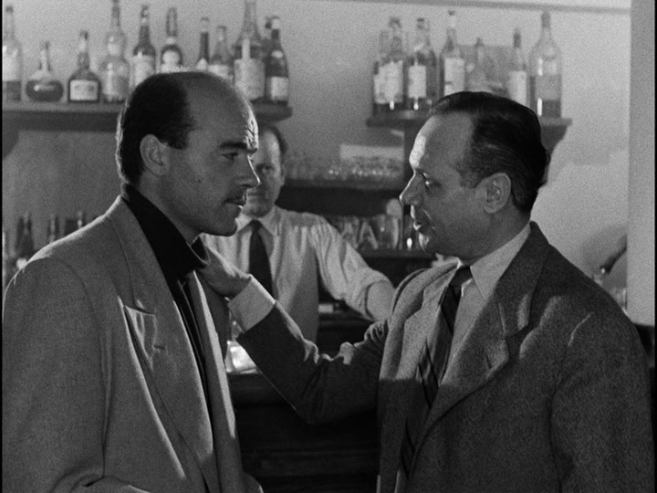 Medium shot of Roger signing up another member of their crew