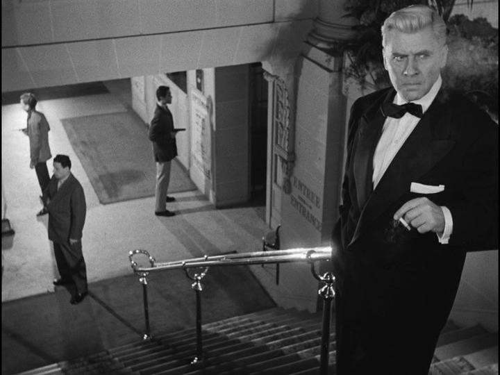 Bob in a tuxedo at his spot at the top of the stairs