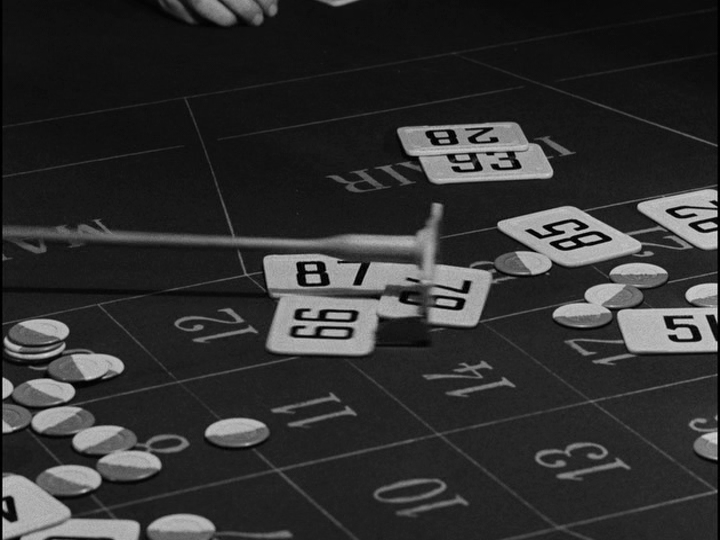 Close-up of bets being placed on 15 in roulette