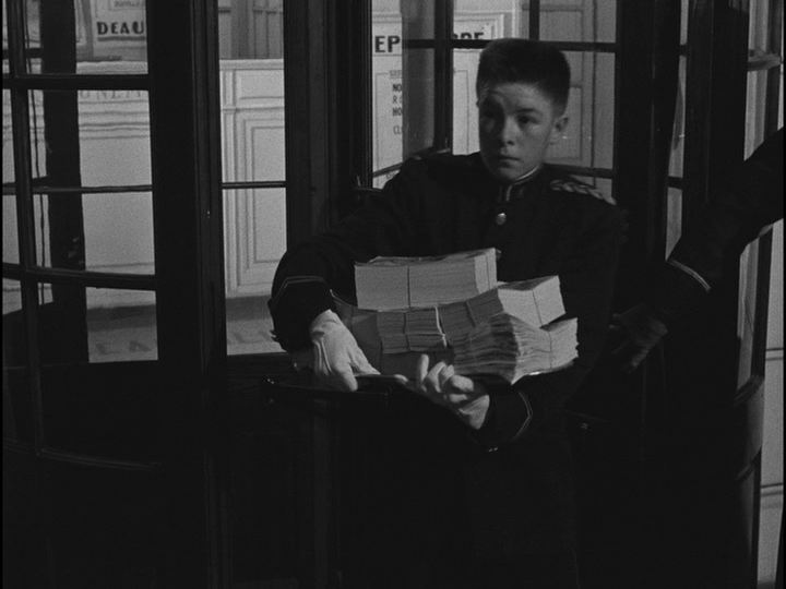 Another bellhop with an arm full of cash