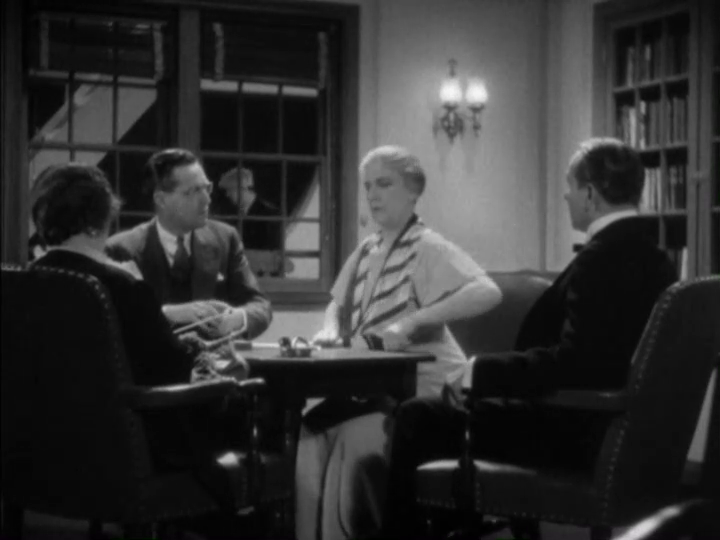 Medium shot of a bridge player looking indignant