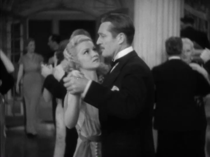 Medium-long shot of Dugan and Foster talking as they dance