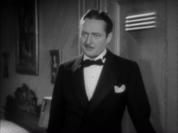 Medium-long shot of Dugan looking bemused