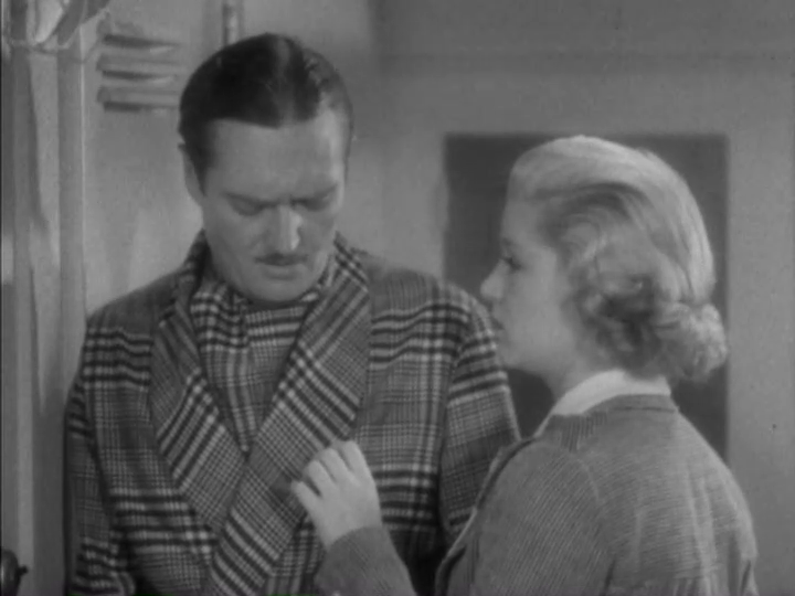 Medium shot of Dugan looking at Foster's hand