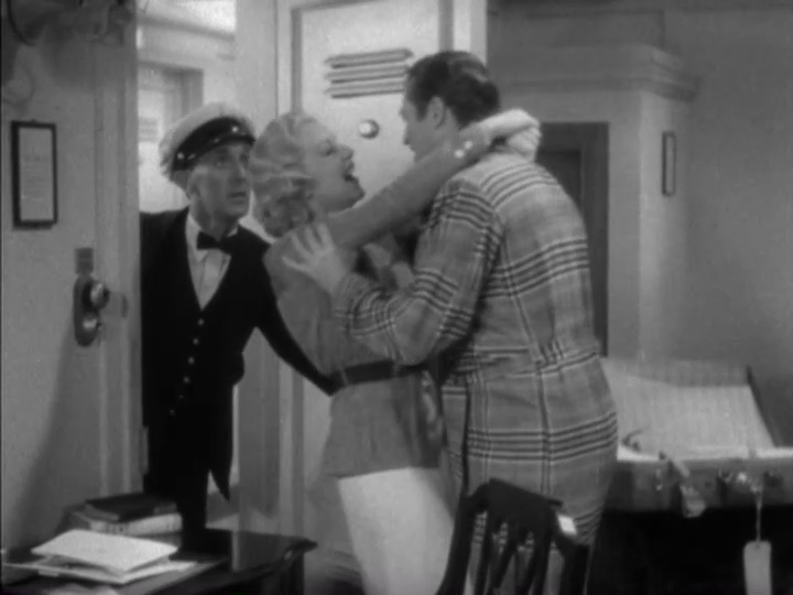 Medium-long shot of Foster, her arms still around Dugan's neck, laughing as steward opens the door and looks puzzled