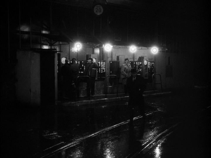 Nighttime street scene in the rain