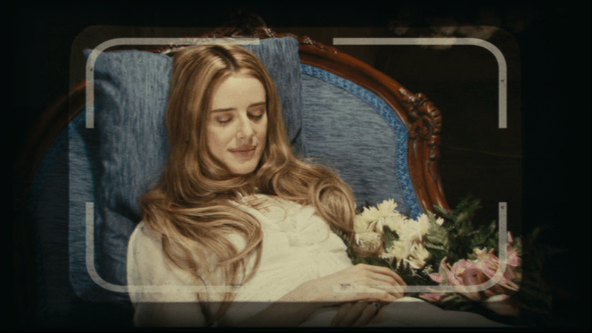 In focus POV medium shot of Angelica's body with frame lines