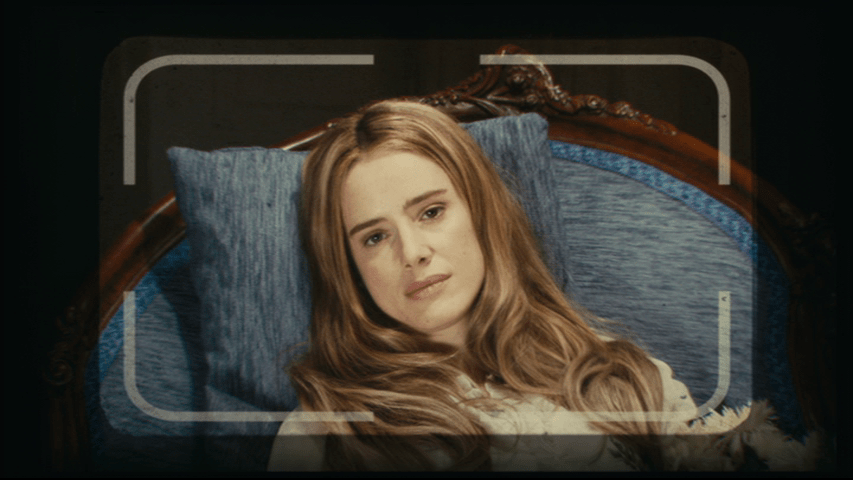 Close-up of Angelica as seen through Isaac's camera with her eyes open