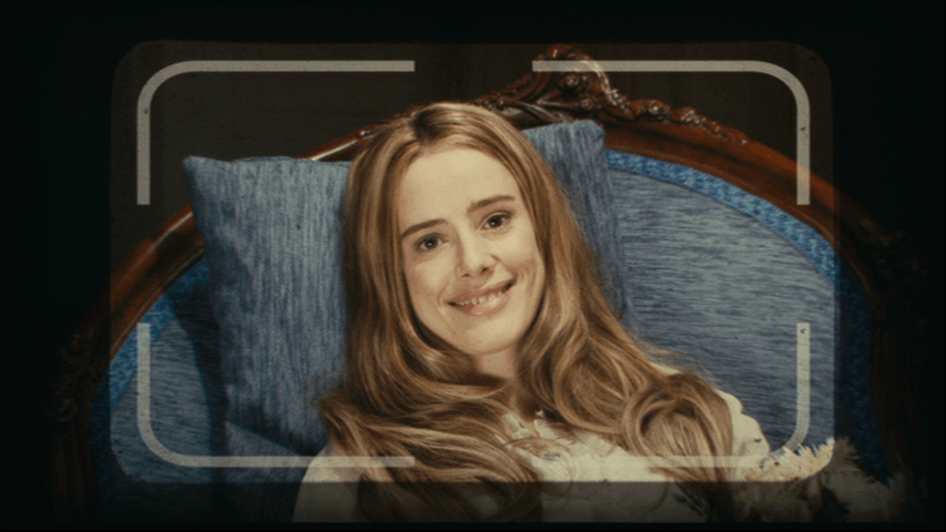 Continuation of the previous shot: Angelica is now beaming at the camera