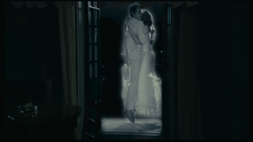 Continuation of the previous shot: the two figures rise off the ground...