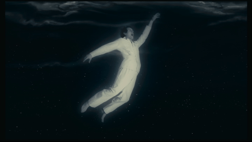 Long shot of a flailing Isaac tumbling through the air