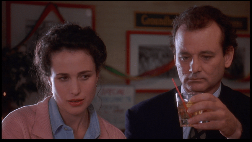 In a continuation of the previous shot, Phil looks at his drink...