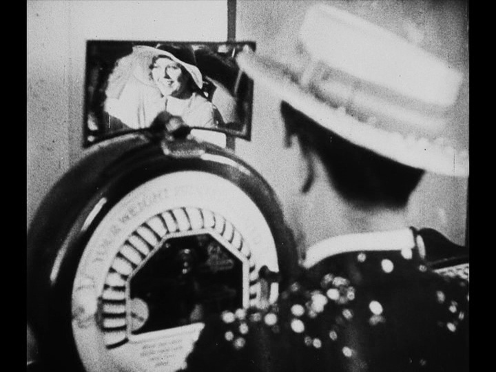 Continuation of the previous shot: Mary's reflection is now in focus