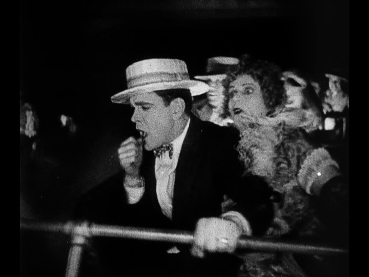 Medium shot of Jim reacting in horror as he realizes Mary's car is on fire