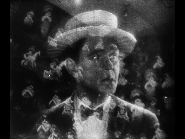 Close-up of Jim searching for Mary also superimposed over a crowd shot